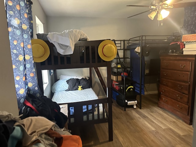 bedroom featuring hardwood / wood-style floors and ceiling fan