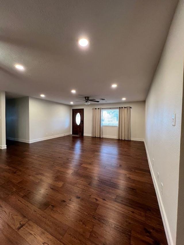 unfurnished room with dark wood-style floors, recessed lighting, baseboards, and a ceiling fan