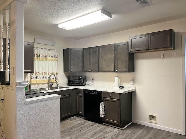 3265 N Willowood Ln, Beaumont, TX 77703 - kitchen featuring black appliances, light wood finished floors, and light countertops