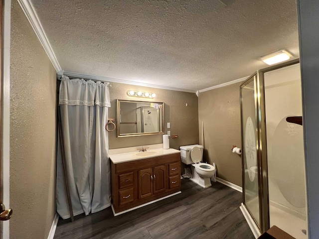 3265 N Willowood Ln, Beaumont, TX 77703 - bathroom featuring crown molding, a textured wall, a textured ceiling, a shower stall, and wood finished floors