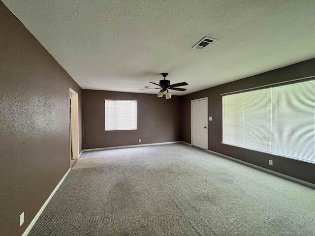 3265 N Willowood Ln, Beaumont, TX 77703 - carpeted spare room featuring a ceiling fan, a textured ceiling, and a textured wall