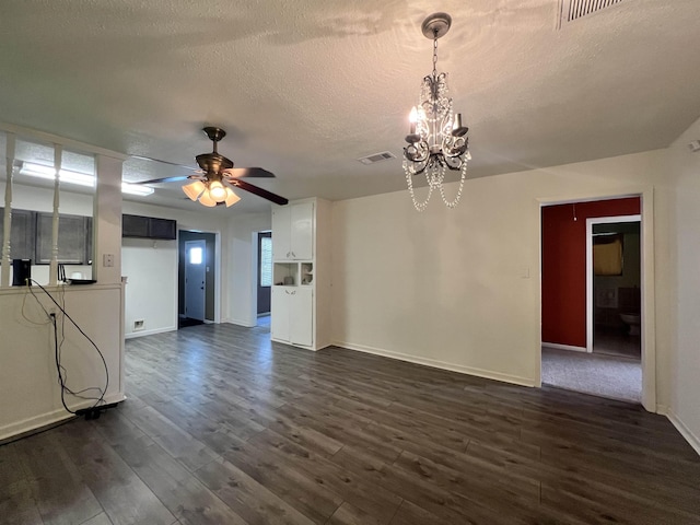 3265 N Willowood Ln, Beaumont, TX 77703 - unfurnished living room featuring a chandelier, a textured ceiling, dark wood-type flooring, and a ceiling fan