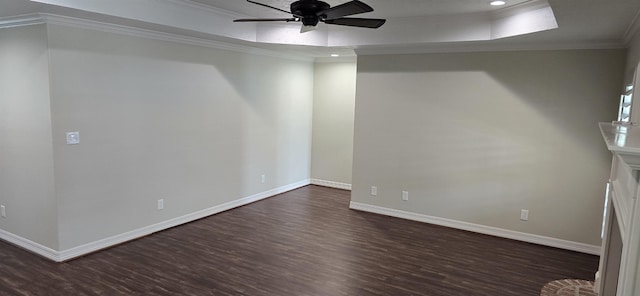 4418 Kandywood Dr, Port Arthur, TX 77642 - spare room with dark wood-style floors, a raised ceiling, ornamental molding, ceiling fan, and recessed lighting