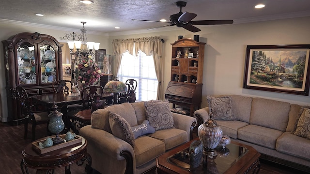 living area featuring recessed lighting, ceiling fan with notable chandelier, a textured ceiling, and ornamental molding