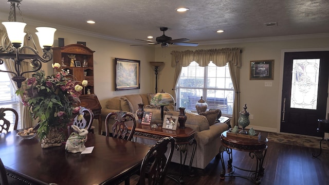 dining space featuring crown molding, wood finished floors, baseboards, and a textured ceiling