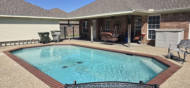 view of pool featuring a fenced in pool, ceiling fan, a patio, and fence