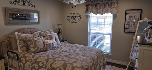 bedroom featuring baseboards