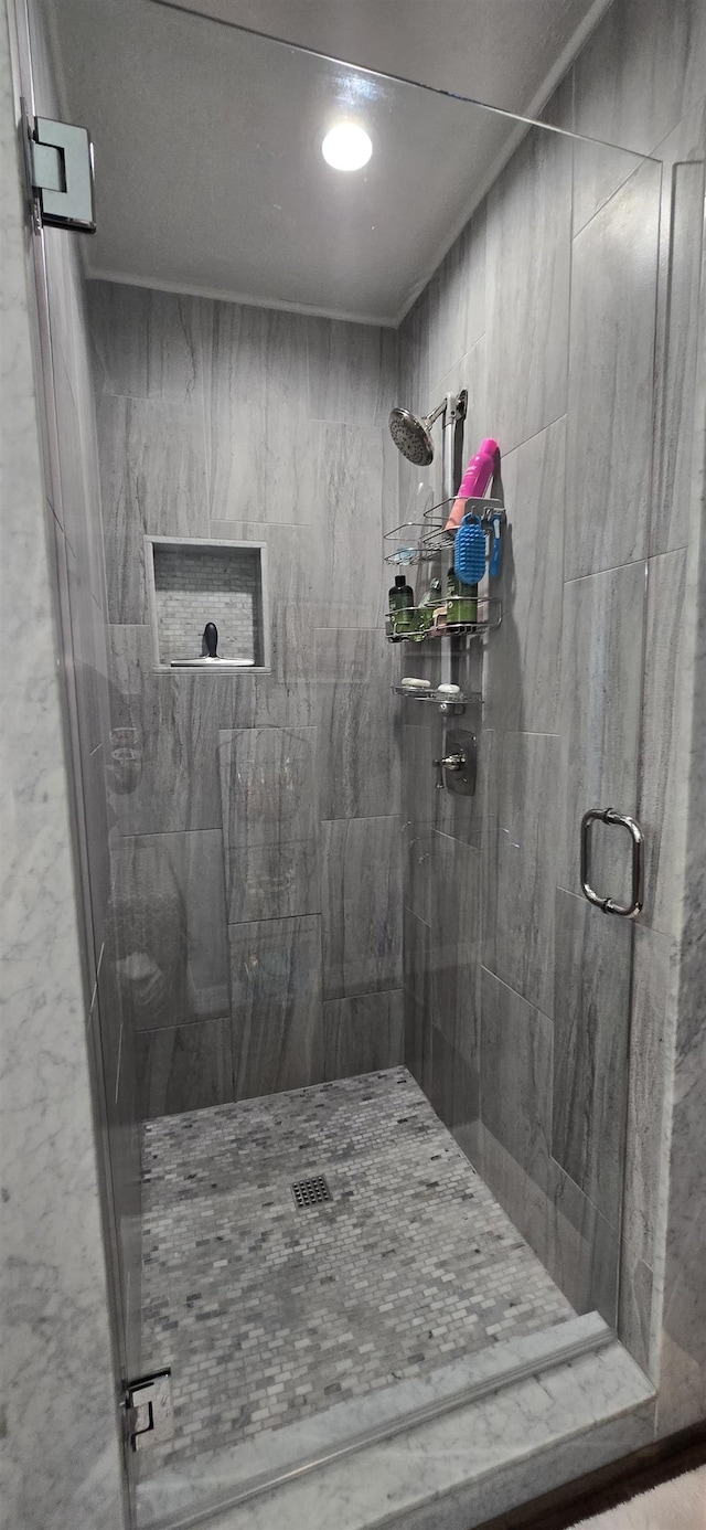 full bath featuring a shower stall