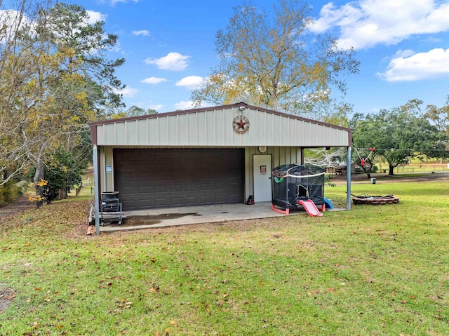 garage with a yard