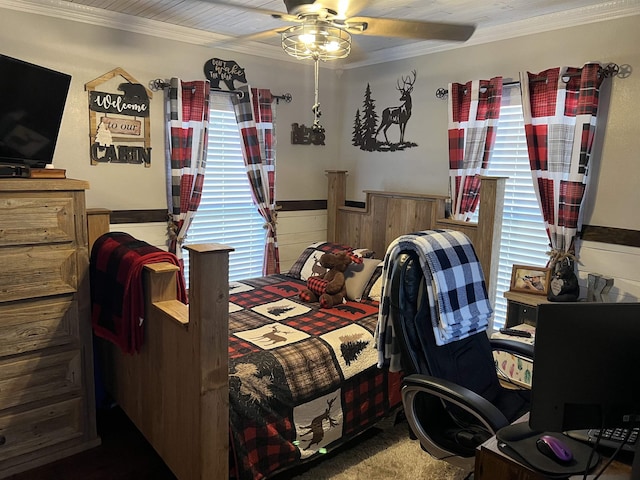 bedroom with carpet flooring, ceiling fan, and crown molding