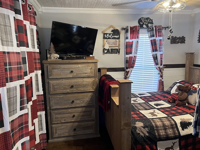 bedroom featuring crown molding, wood ceiling, and wood walls