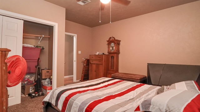 carpeted bedroom featuring visible vents, a ceiling fan, and a closet