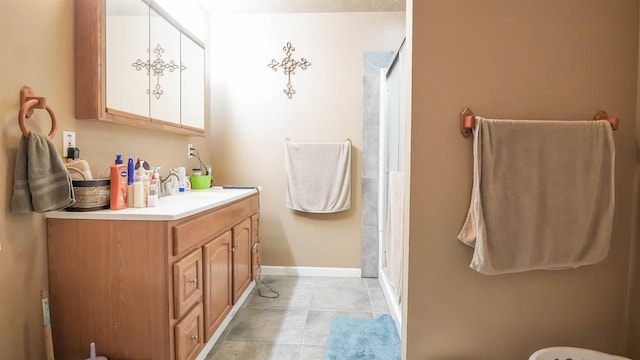 full bathroom with walk in shower, vanity, and baseboards