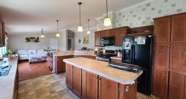 kitchen with black appliances, crown molding, hanging light fixtures, a kitchen island, and kitchen peninsula