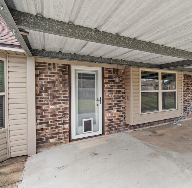 property entrance featuring a patio area