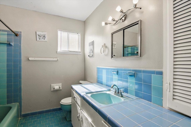 bathroom with tile patterned flooring, vanity, and toilet