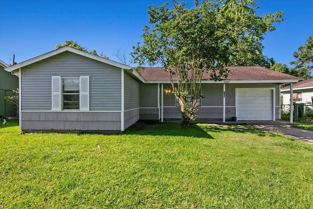 view of front of house with a garage and a front yard