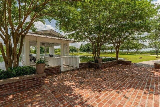 7705 Savannah St, Beaumont, TX 77707 - porch with a water view and a yard