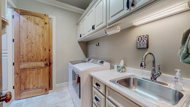 7705 Savannah St, Beaumont, TX 77707 - laundry area with washer and dryer, cabinet space, ornamental molding, and light tile patterned floors