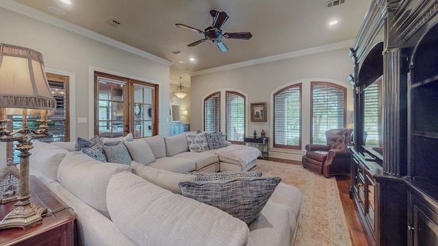 7705 Savannah St, Beaumont, TX 77707 - living room with french doors, ceiling fan, light wood-style flooring, crown molding, and recessed lighting