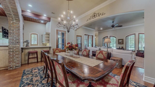 7705 Savannah St, Beaumont, TX 77707 - dining space with wood finished floors, healthy amount of natural light, a ceiling fan, ornamental molding, and recessed lighting