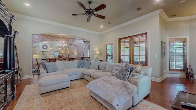 7705 Savannah St, Beaumont, TX 77707 - living room with arched walkways, a ceiling fan, wood finished floors, baseboards, and recessed lighting