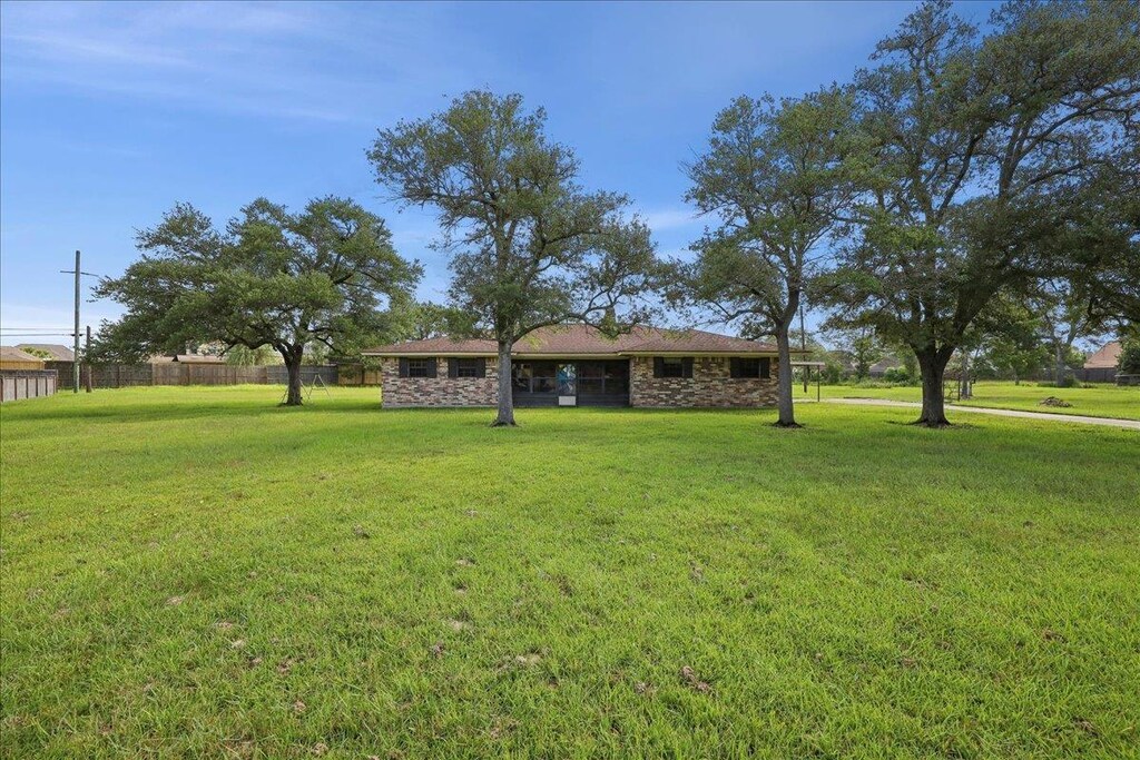 200 Pinata Dr, Lumberton, TX 77657 - view of front facade featuring stone siding
