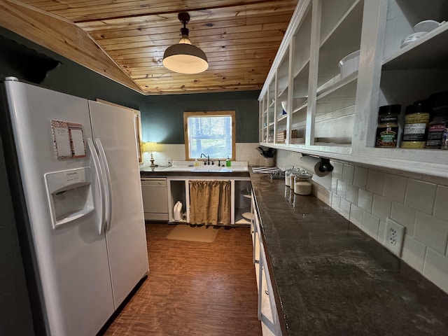 kitchen with white appliances, hanging light fixtures, dark hardwood / wood-style floors, backsplash, and wooden ceiling