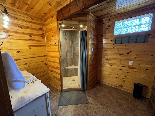 bathroom featuring a shower, wooden walls, wood ceiling, and vanity