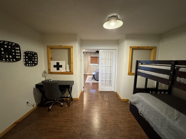 bedroom with dark hardwood / wood-style flooring