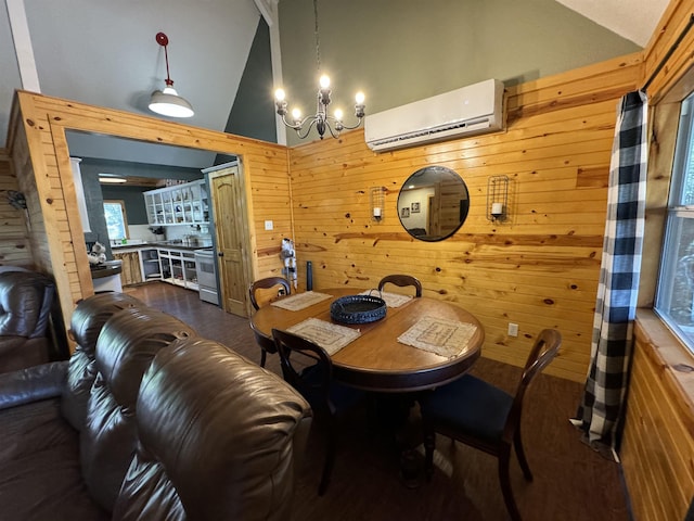 dining area with a wall mounted AC, an inviting chandelier, high vaulted ceiling, and wood walls