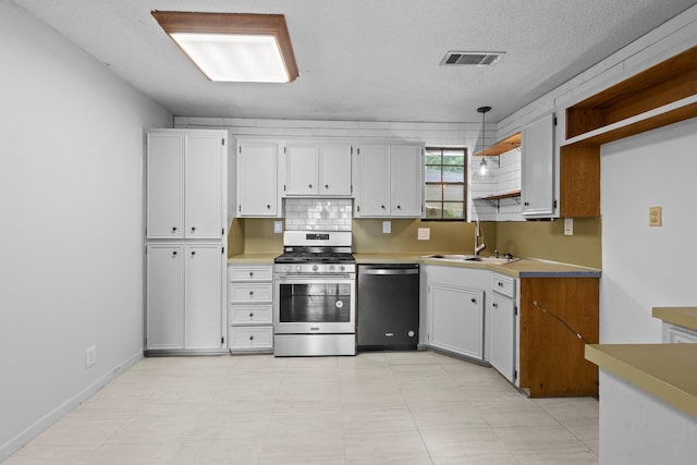 305 White Oak Trl, Bridge City, TX 77611 - kitchen with stainless steel appliances, a sink, open shelves, a textured ceiling, and white cabinets