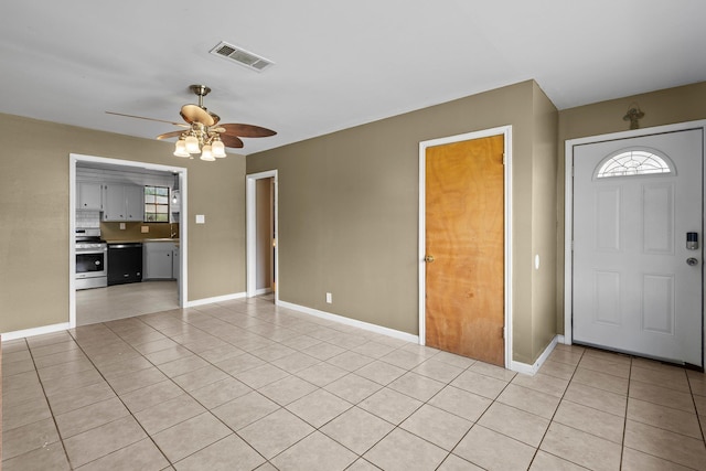 305 White Oak Trl, Bridge City, TX 77611 - foyer entrance featuring light tile patterned flooring, a ceiling fan, and baseboards