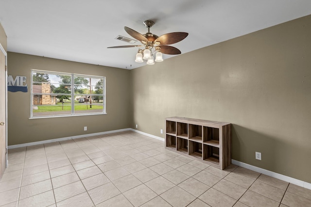 305 White Oak Trl, Bridge City, TX 77611 - spare room with ceiling fan, light tile patterned floors, and baseboards