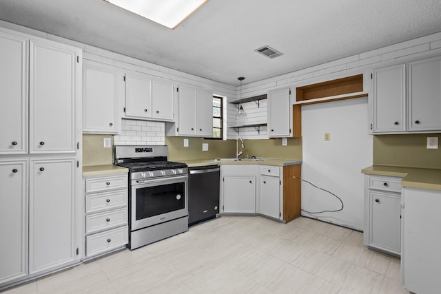 305 White Oak Trl, Bridge City, TX 77611 - kitchen featuring dishwasher, gas range, a sink, open shelves, and hanging light fixtures