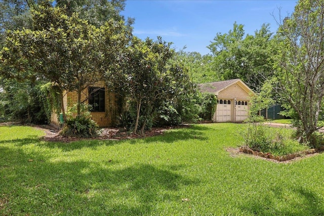 view of yard featuring a garage