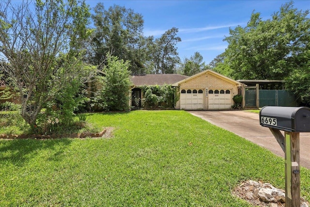 ranch-style house featuring concrete driveway, fence, a front lawn, brick siding, and a garage