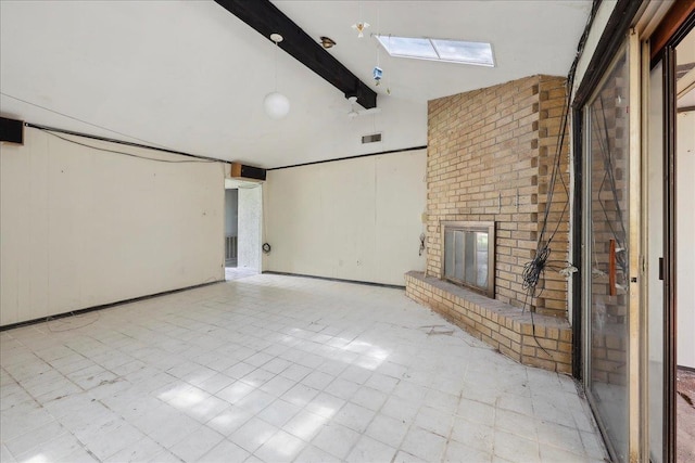 unfurnished living room featuring a skylight, beamed ceiling, a brick fireplace, visible vents, and high vaulted ceiling