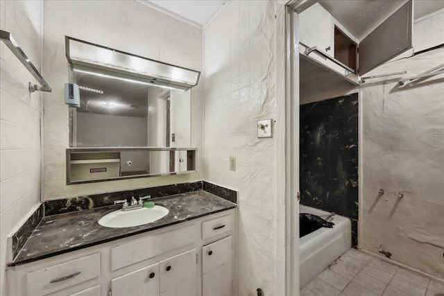 bathroom with tile patterned flooring and vanity