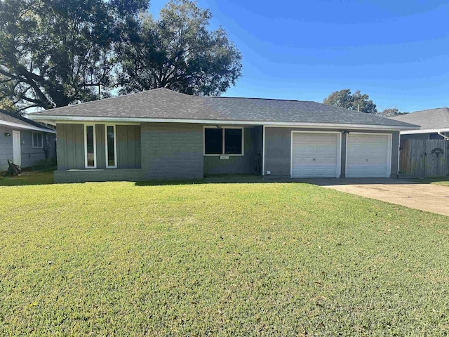 ranch-style house with a garage and a front lawn