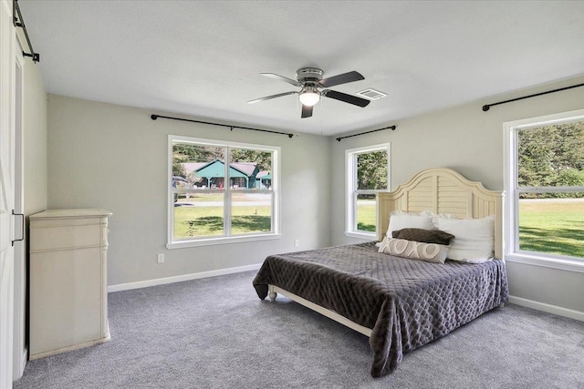 carpeted bedroom featuring ceiling fan