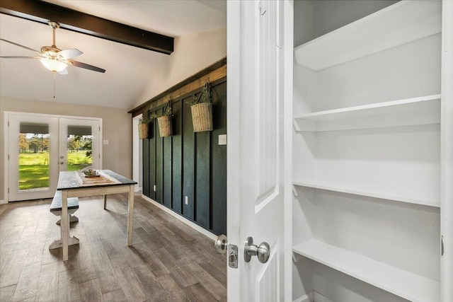 office featuring vaulted ceiling with beams, ceiling fan, french doors, and hardwood / wood-style flooring