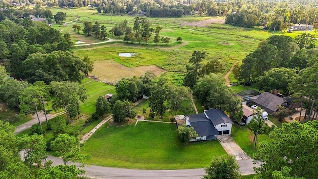 birds eye view of property with a rural view