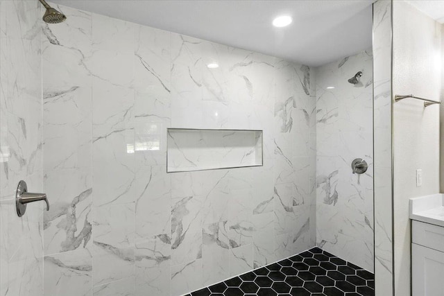 bathroom with tiled shower