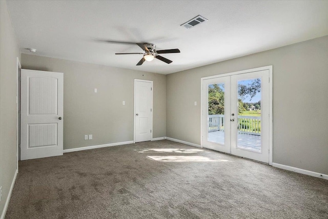 carpeted spare room with french doors and ceiling fan