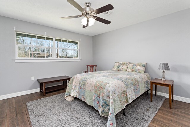 314 Pinehurst Dr, Sour Lake, TX 77659 - bedroom with ceiling fan, baseboards, and wood finished floors