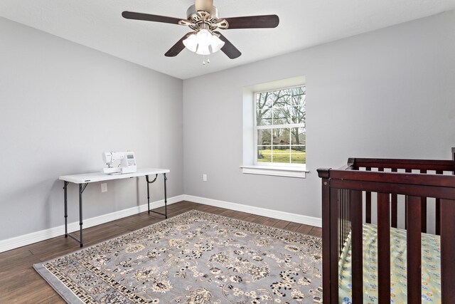 314 Pinehurst Dr, Sour Lake, TX 77659 - bedroom featuring ceiling fan, baseboards, and wood finished floors