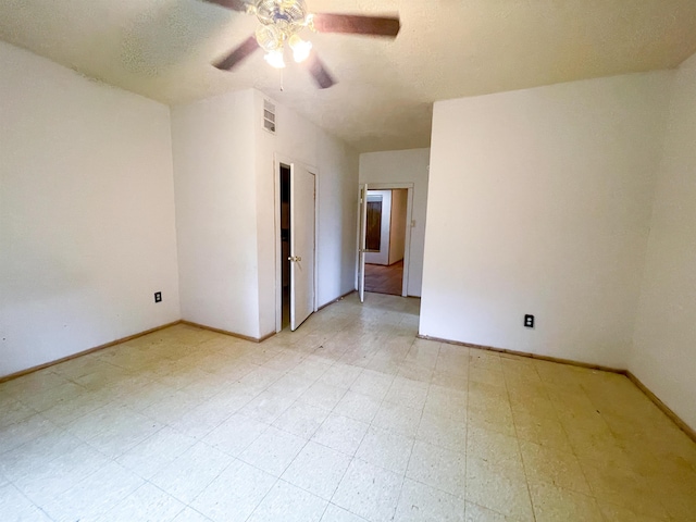 spare room with ceiling fan