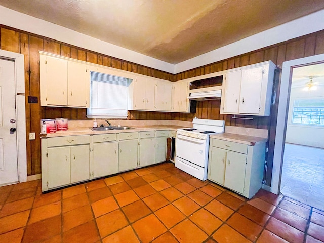 kitchen featuring white cabinetry, sink, ceiling fan, and white stove