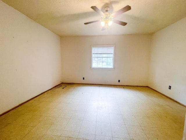 spare room with ceiling fan